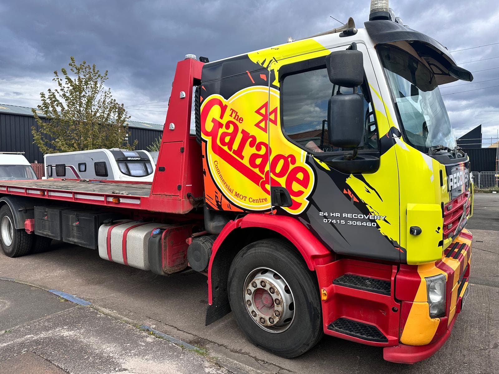 Recovery truck loading a vehicle on site in Clydebank